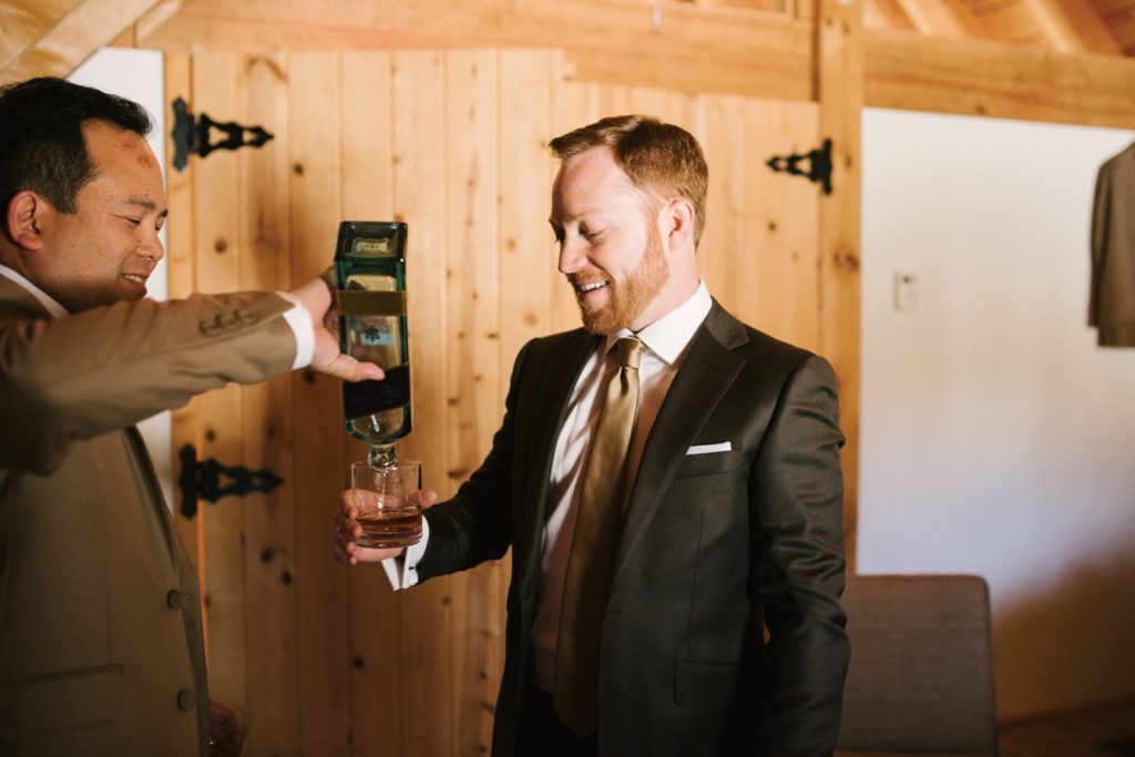 Groom takes a drink before he marries his bride