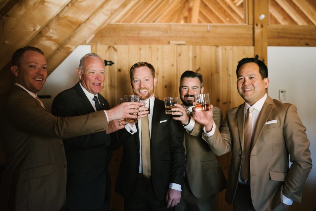 Groomsmen toasting to the wedding day