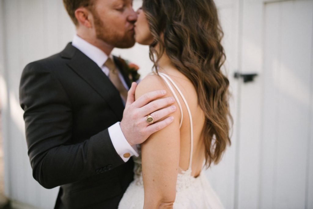 Bride and groom share an intimate moment during their first look on their wedding day