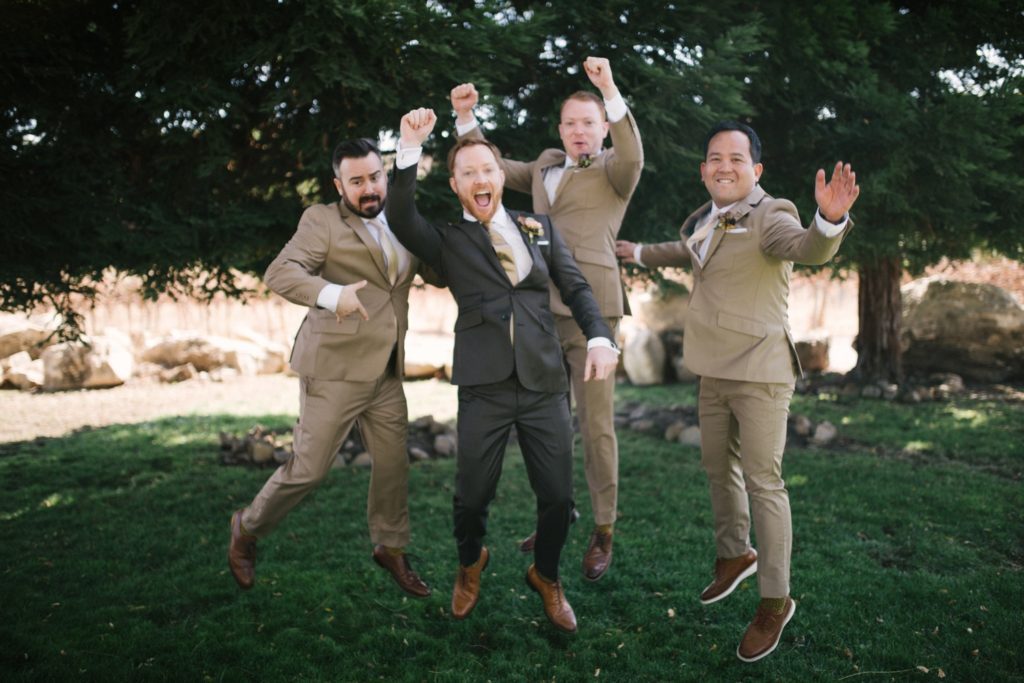 Groomsmen jump for joy
