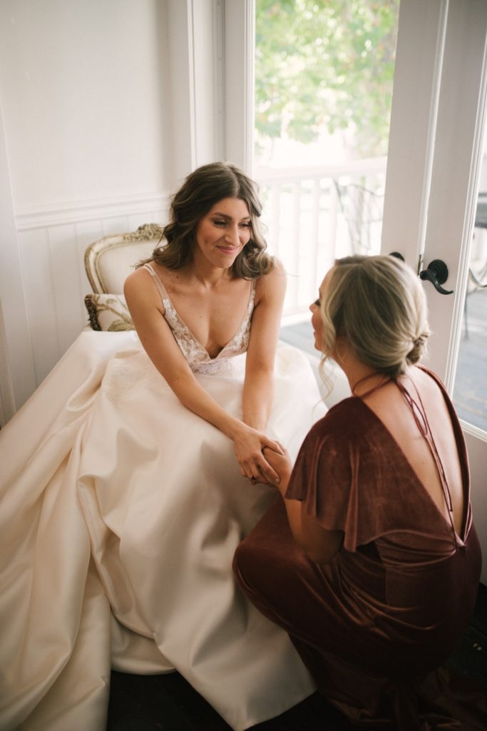 Sister of the bride enjoys a moment before the wedding