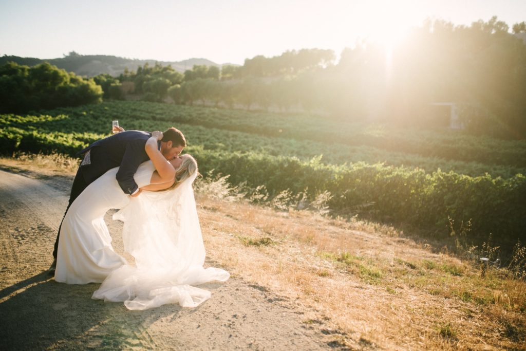 Bride and groom kiss as the sun sets at their wedding at Marfarm in San Luis Obispo. SLO Wedding Photographer