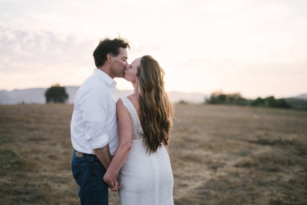 Bride and groom kiss during sunset at Flying Caballos Ranch. SLO wedding photographer