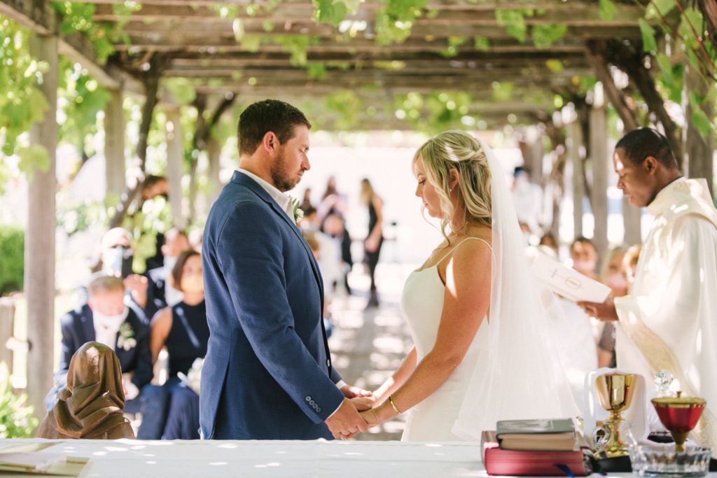 couple gets married in the courtyard at mission san luis obispo. wedding photographers slo