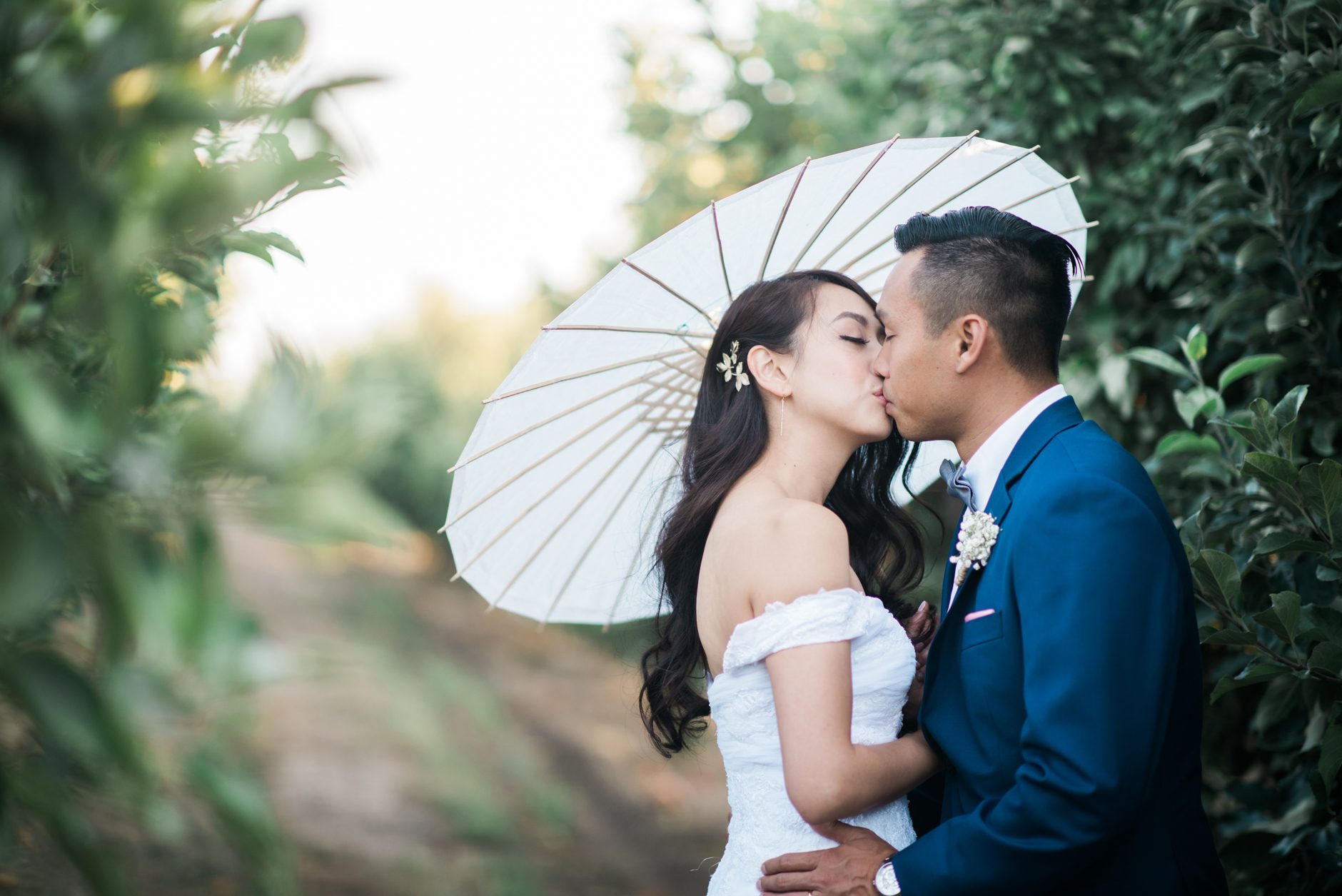 Hartley Farm Wedding with white umbrella by Paso Robles California wedding photographer Yvonne Goll Photography