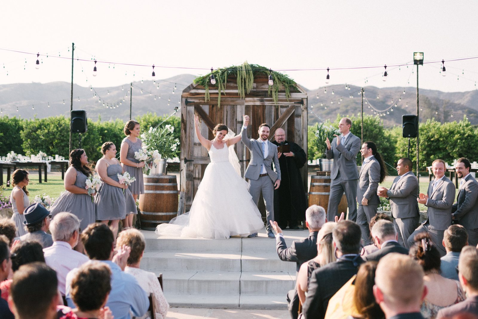Bride and groom celebrating during ceremony at Limoneira Ranch Wedding by San Luis Obispo Wedding Photographer Yvonne Goll Photography