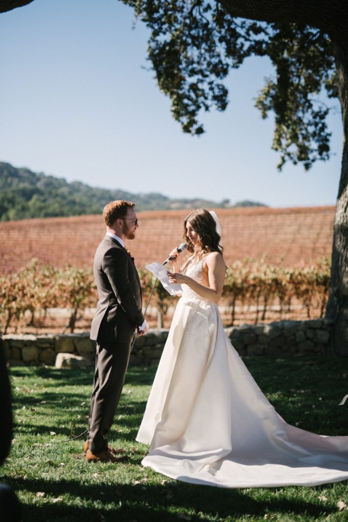 bride reads personal vows to groom hammersky vineyard
